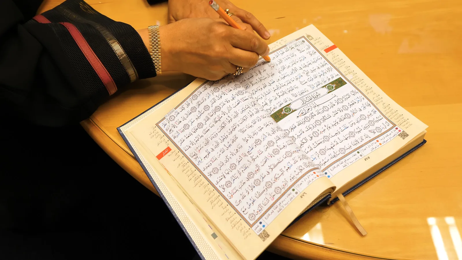An open Qur'an, the heart of every day at Ayat Academy